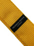 Yellow gold knitted tie with white polka spots